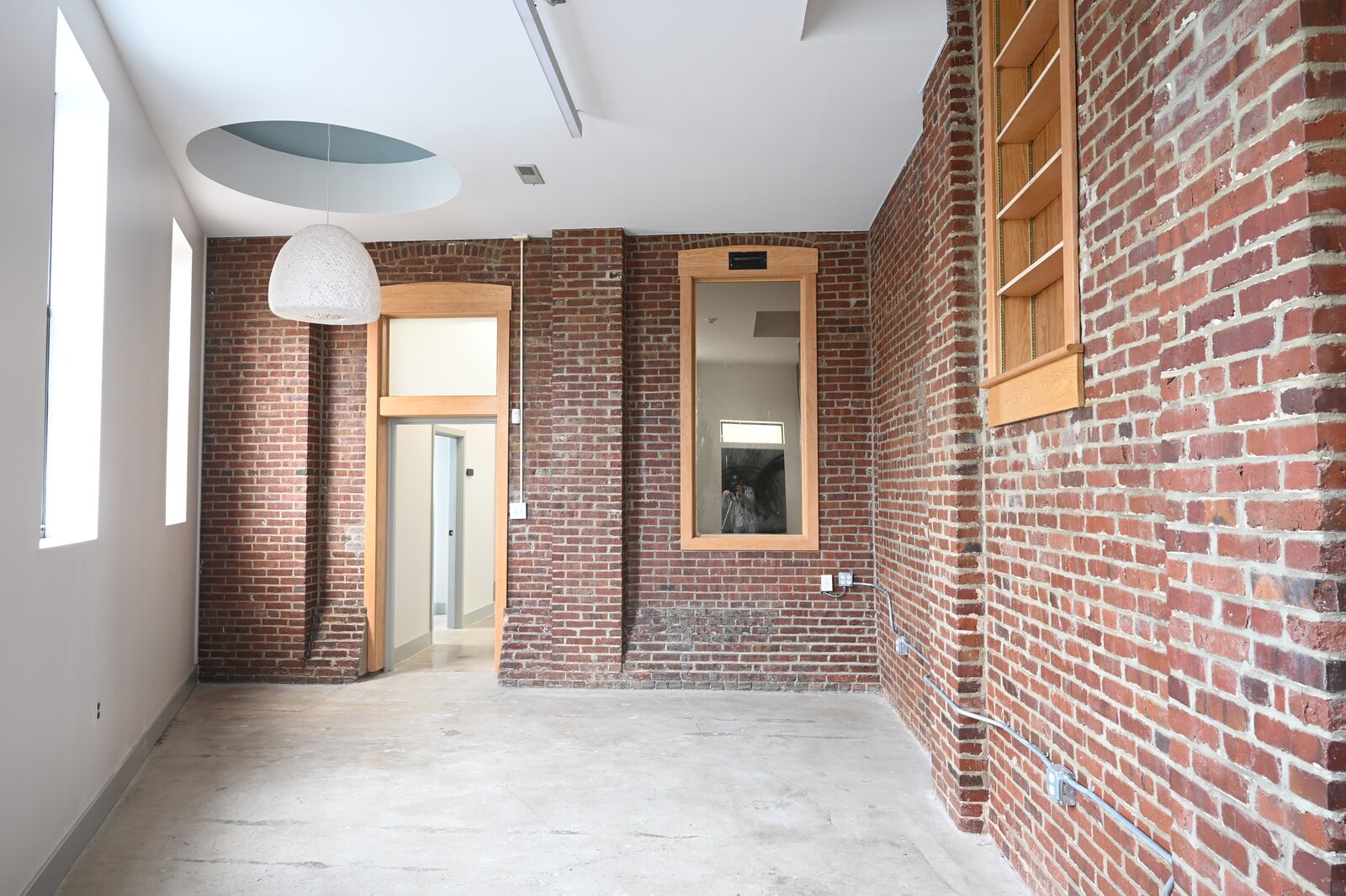 Light-filled studio with exposed brick walls