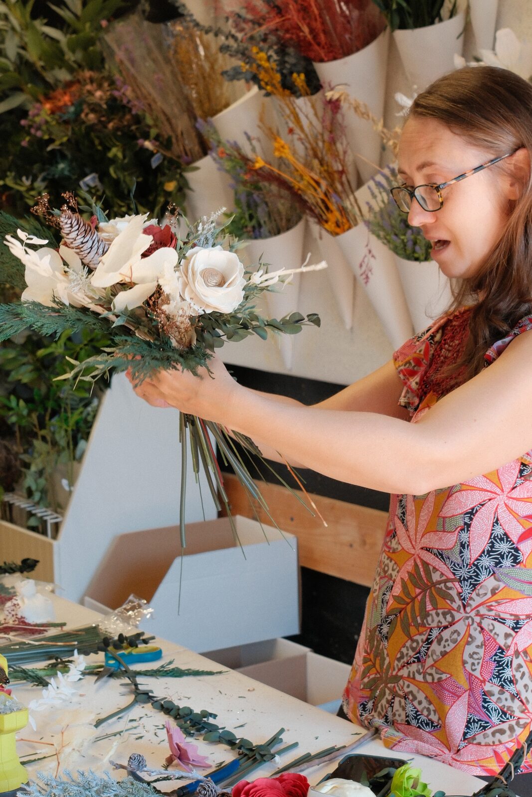 Floral designer at work inside a studio at 101 Washington Street